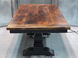Grey/brown solid wood trestle dining table. Furniture Old And Vintage Small Distressed Pedestal Trestle Dining Table Made From Reclaim Reclaimed Wood Dining Table Dining Table Bases Trestle Dining Tables