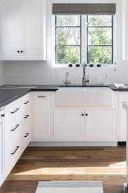 White shaker style kitchen cabinets are often paired with unornamented hardware to complement their simplicity. White Shaker Cabinets With Black Hardware White Kitchen Cabinets With Black Hardware Countertopsnews