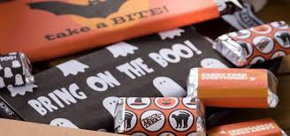 I used photo mounting squares to adhere, but you could also use double sided tape. Printable Candy Bar Wrappers For Halloween Free Diy Candy