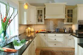 When contrasted with the light countertops and cabinets, this kitchen looks. Cream Cabinet With Wood Floor Ideas Photos Houzz