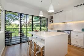 White And Wood And Black Kitchen Via Domain Com Au Pendants Lighting Kitchen Whitekitchen Pendantligh Renting A House Black Kitchens House