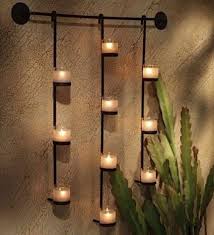 These metal wall candle sconces are not only aesthetically appealing but also are very durable and can last for a long time even after daily rough usages. Wrought Iron Candle Holders Beautiful Decoration For The Walls In Every Home Style Candle Wall Decor Candle Wall Sconces Wall Candles