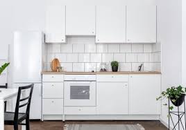 Cream kitchen cabinets with wood floors and wood color countertops. Stylish White Kitchen Appliances White Appliance Ideas