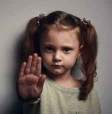 A grown man looms behind my three-year-old daughter. Occasionally he will  poke or tickle her and she responds by shrinking. Smaller and smaller with  each unwanted advance. I imagine her trying to