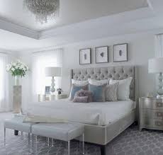 The master bedroom below resembles a luxury hotel room, complete with a chaise lounge in the bathroom wainscoting ideas: 20 Serene And Elegant Master Bedroom Decorating Ideas