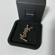 opyum ysl twisted brooch in metal