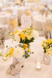 Shop a huge selection of wholesale flowers for diy weddings, and bulk flowers for events. Yellow And White Centerpiece With Mums And Craspedia Yellow Wedding Flowers Centerpiece Yellow Wedding Flowers White Wedding Decorations