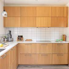 White oak handleless kitchen with caesarstone worktop. Ikea Ekestad Oak Veneer Kitchen Units With White Worktops And Tiles Modern Mid Century Style Kitc Ikea Kitchen Kitchen Inspiration Design Kitchen Inspirations