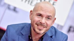 How Pitbull Hopes to Inspire Other Latinxs and Give Back to His Community  (Exclusive)