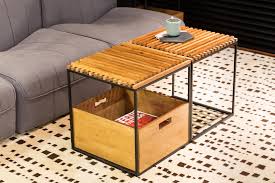 Round tables are a small space savior, and this side table could easily be repurposed as a coffee table for a super narrow space. Moveable Tables Were Designed For This Small Apartment So They Can Change From Kitchen Counter Seating To A Dining Table