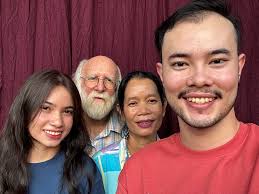 Dani Jump and his Khmer bee hunter picking ripe cashew nut fruit