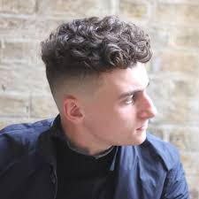 Get the latest and greatest hairstyles for men! 27 Sexiest Short Curly Hairstyles For Men Menshaircuts Com Frizzy Hair Men Curly Hair Men Men S Curly Hairstyles