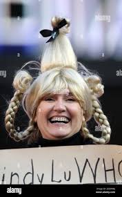 Decked out in New Orleans Saints practice gear, country music singer Kenny  Chesney (7) loses a punt during practice at the NFL team's summer football  training camp in Jackson, Miss., Monday, Aug.