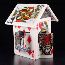 It might look unstable, but if you build it from triangles like the picture shows and glue it well, the house will actually be able to support small toys! Card House Cottage Playing Card Crafts Playing Cards Art Card Craft
