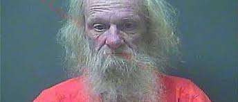 Charges filed after 34 dogs found alive, 1 dead in Michigan City home