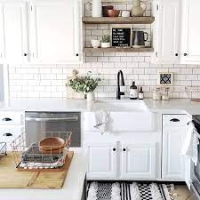 Removing The Upper Cabinets Above The Sink And Replacing Them With Open Shelves Was One Of The Be Kitchen Tiles Design Kitchen Design White Subway Tile Kitchen