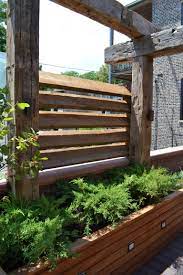 Chicago Reclaimed Timber Pergola With Louvered Slats And Glass Panels Built In Tali Planters With Ornamental Trees Timber Pergola Rustic Pergola Diy Pergola