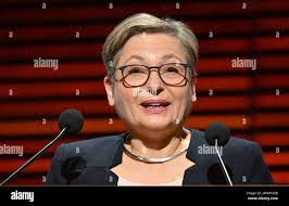 Weimar, Germany. 29th Mar, 2023. Andrea Titz, Chairwoman of the German  Judges' Association, follows the greetings during the opening of the 23rd  Judges' and Prosecutors' Day. The judicial summit of the German