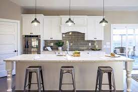 The white tile backsplash is practical and attractive. Modern Farmhouse Kitchen Degnan Design Build Remodel