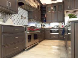 This photo shows the former dark cabinets, which the homeowners felt made the kitchen look dreary. Modern Rift White Oak Kitchen Fine Homebuilding