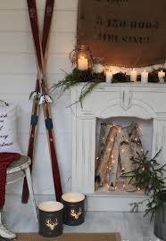 Faux Fireplace With Candle Lanterns And Firewood Decorated With Lights Christmas Fireplace Decor Winter Home Decor Rustic Winter Decor