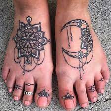 Sun tattoos have powerful meaning and tattoos like this add more elegance to the feminine features. Sun And Moon Mandala Foot Tattoos Tattoo Models Designs Quotes And Ideas