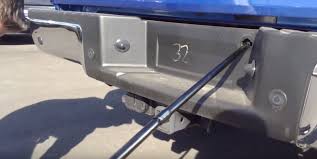 · insert crank into the new hole. How To Lower Your Ford Truck S Spare Tire Ford Trucks Com