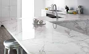 The streamlined kitchen is defined by its white cabinetry against the surrounding cedar walls, ash wood floors, and wooden countertops. Kitchen Countertop Ideas The Home Depot