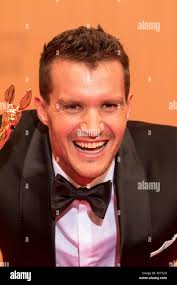 In this Jan. 12, 2015 photo "Sneaker PAwn" proprietor Chase Reed looks up  from his phone while talking to a reporter at his store in the Harlem  section of New York. Reed