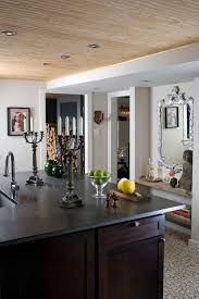 The wood kitchen island countertop, dark wood stools, wicker pendant lights, and wood floor enhance the farmhouse feel. Beadboard Ceiling A Beautiful Ceiling For Every Room Of Your Home