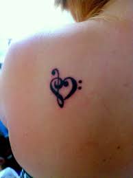 My Name Is Kristi I Got My Tattoo Done At Atomic Tattoos In Tampa Florida It S A Bass Clef And A Treble Clef In The Shape Of A Heart To S