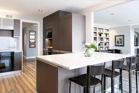 Our steel fabricators built a steel skeleton which our wood artisans then clad in beautiful walnut. Classic Kitchens Design Studio On Instagram Modern Condo Overlooking The Country Club Plaza Kitchen Design Classic Kitchens Classic Kitchen Design