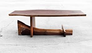 Live edge slabs are perfect for making coffee tables. Walnut Cantilever Table Live Edge Coffee Table Functional Art Custom Furniture Reclaimed Sol Live Edge Coffee Table Coffee Table Design Live Edge Table
