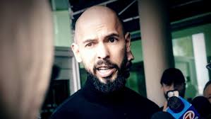 Controversial influencer Andrew Tate returns to U.S. amid sex trafficking  charges