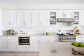 However, over time, a white appliance, in particular, could begin to show a buildup of dirt on its handles. Contemporary Galley Kitchen With White Cabinets And Stainless Steel Appliances Hgtv