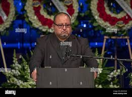 Gregory Casillas holds his emotions while speaking at funeral of his son  fallen Pomona officer Greggory Casillas at Purpose Church in Pomona,  Calif., Thursday, March 22, 2018. The rookie police officer was