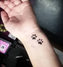Paw tattoos can have various meanings like memory of a pet, movement/moving forward, totem animal, ferocity, power and strength, children and both small and large paw print tattoos looking pretty good on the wrist and you get to see your pup's paw all the time. Paw Tattoos On Wrist
