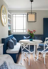 A modern table and chairs set pendant lighting and wall decor put a stylish spin on a traditional breakfast nook. Bright And Cheery Breakfast Nook Ideas Town Country Living
