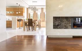 A sophisticated, neutral living room in chicago's historic palmolive building features a clever mix of antiques and vintage finds, which create a sense of balance. 2018 Trends Flooring Transitions Between Rooms Indianapolis Flooring Store