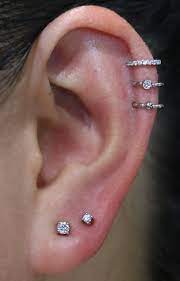 Love The Way These Delicate Earrings Are Aligned Helix Piercing Ideas Unique Piercings For Females Accessories Ear Piercings For Girls Piercings Unique