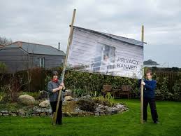 Maybe you would like to learn more about one of these? Outraged Couple Create Unusual Banners To Block Neighbours Views Into Garden Mirror Online