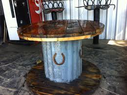 Table I Made From A Wooden Spindle Old Barn Tin And A Couple Of Horseshoes Spool Furniture Barn Tin Barn Wood Projects
