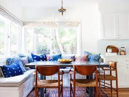 Traditional wood chairs on the opposite side complement the aesthetic and offer guests a different seating option. The Most Beautiful Kitchen Banquettes We Ve Seen