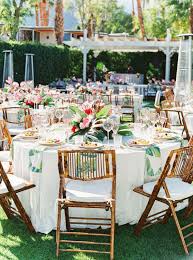 Riviera Palm Springs Wedding With Tropical And Disco Vibes Palm Springs Wedding Wedding Table Setup Coconut Leaf Decor