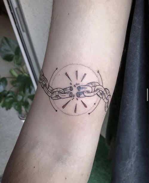 Fine line geometric broken chain tattoo
