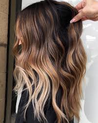 Her hair starts a deep and dark brown which is shiny and striking, but balayage blends a shade of vibrant copper throughout, adding light and lift to the hair, which this lady has curled and tousled for a wonderful end result. 50 Hottest Balayage Hair Ideas To Try In 2021 Hair Adviser