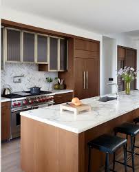 No rule says you have to attach your new marble countertop to your wood bathroom vanity. 5 White Marble And Wood Kitchens We Love