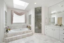 Luxury master bathroom with beige marble floor plan and gray square rug. Master Bath In Luxury Home With Marble Tub Stock Photo Picture And Royalty Free Image Image 6732416