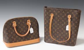 A replica Louis Vuitton handbag, another similar shoulder bag, two replica  Gucci bags and a replica