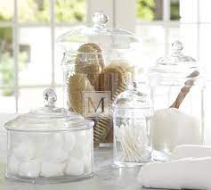 Simple bathroom storage with a retro feel. Classic Glass Bathroom Canisters Pottery Barn